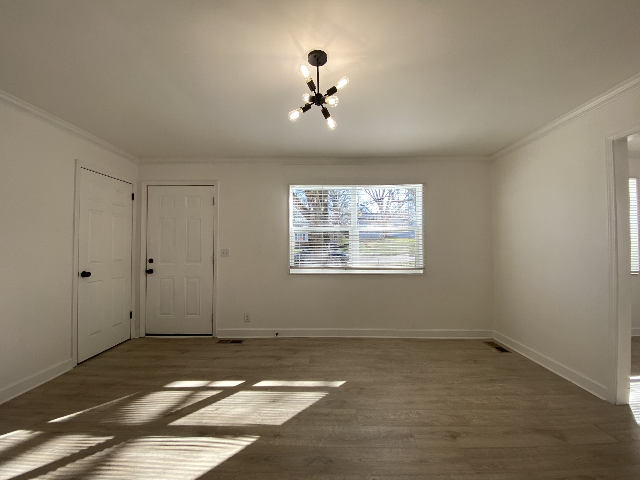 245 Raintree Drive Clarksville, TN 37042 - Photo 12 of 33 a view of a livingroom with a ceiling fan and window