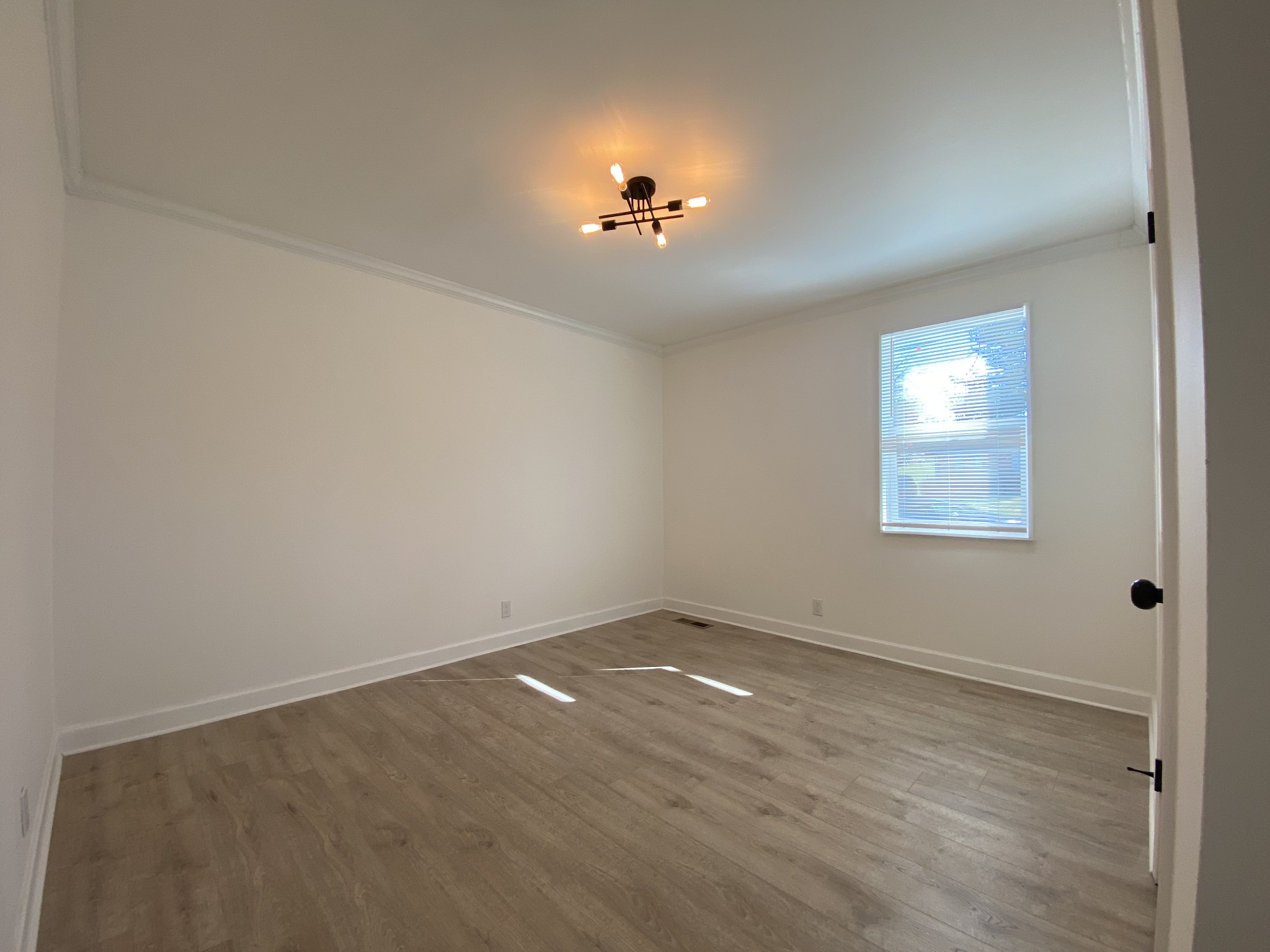 245 Raintree Drive Clarksville, TN 37042 - Photo 17 of 33 wooden floor in an empty room with a window