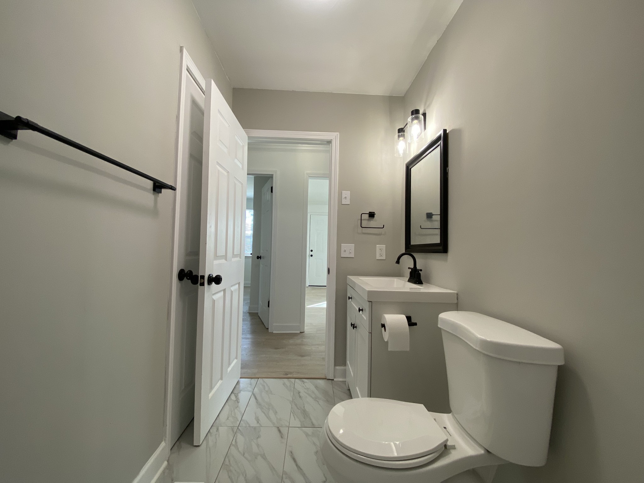 245 Raintree Drive Clarksville, TN 37042 - Photo 18 of 33 a white toilet sitting next to a bathroom sink