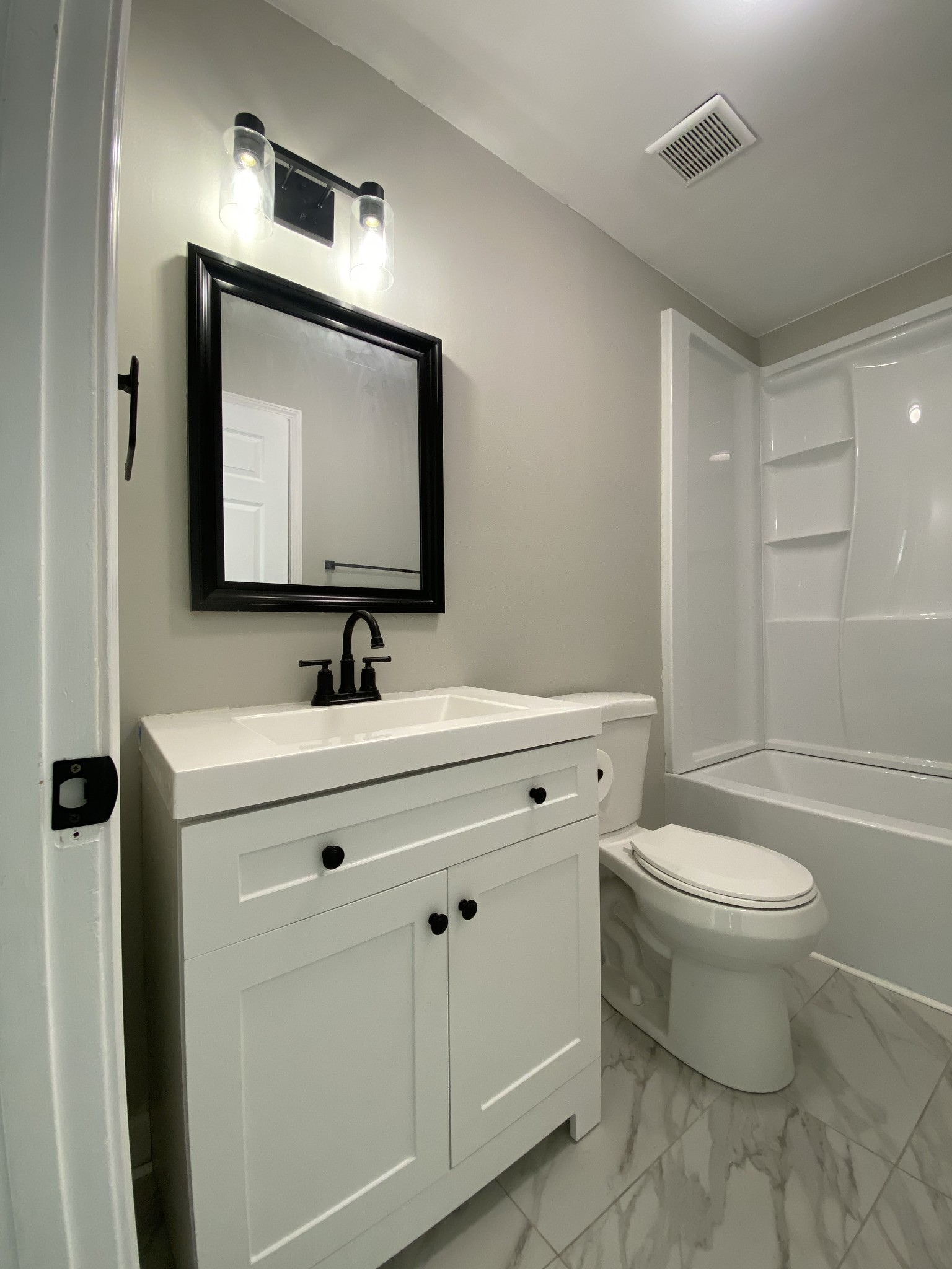 245 Raintree Drive Clarksville, TN 37042 - Photo 20 of 33 a bathroom with a toilet sink and mirror