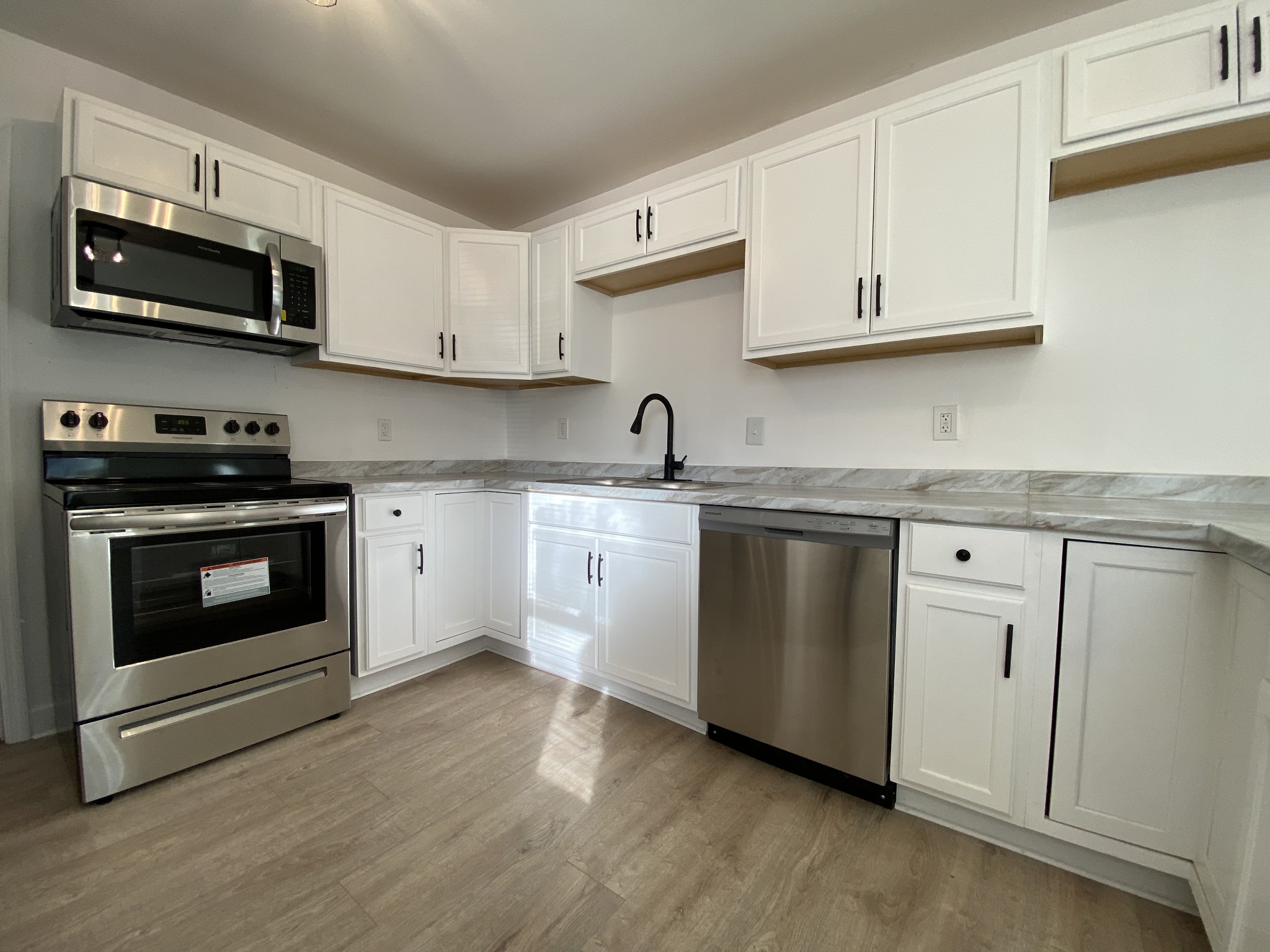 245 Raintree Drive Clarksville, TN 37042 - Photo 6 of 33 a white kitchen with granite countertop stainless steel appliances