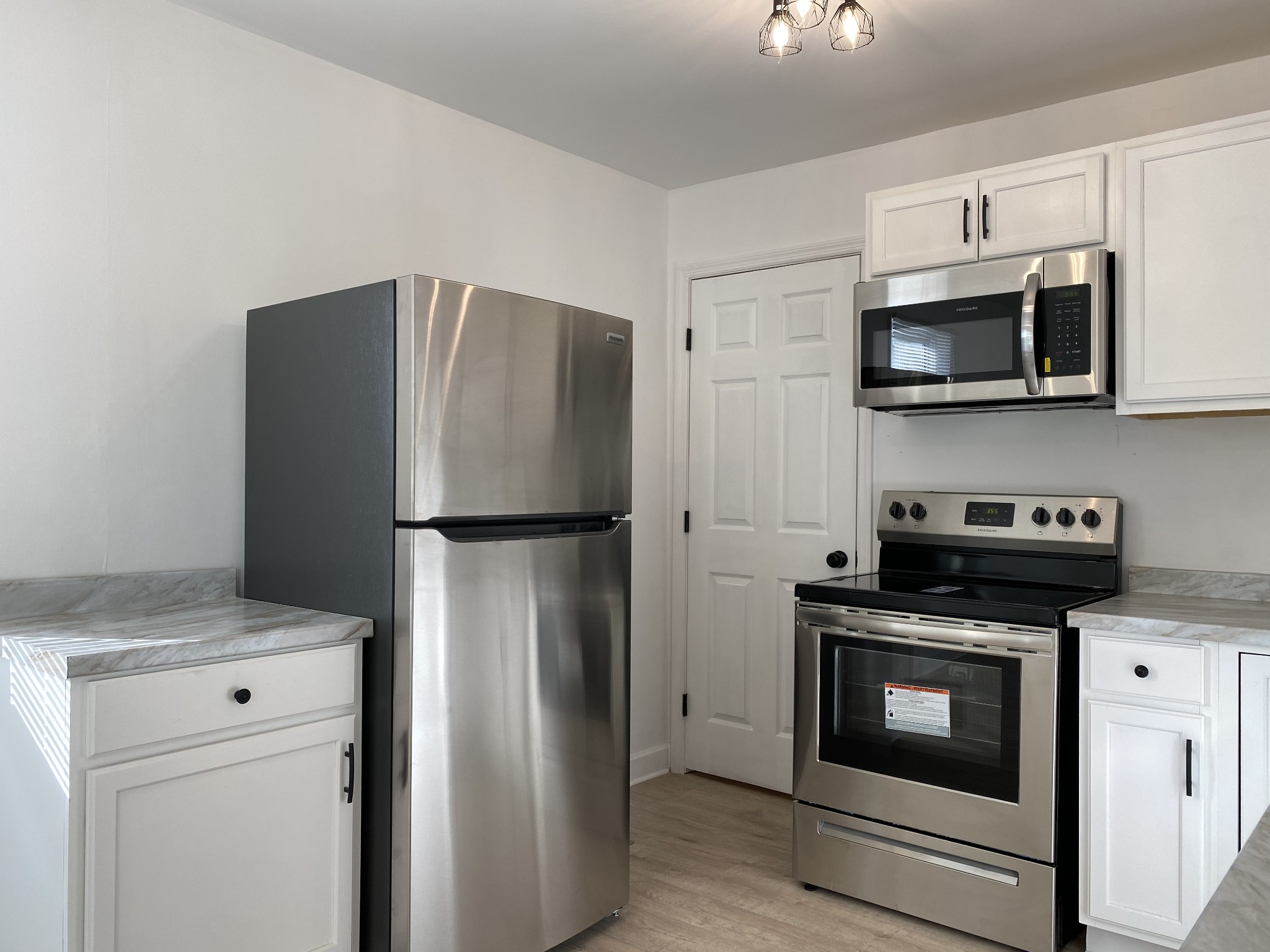 245 Raintree Drive Clarksville, TN 37042 - Photo 7 of 33 a kitchen with stainless steel appliances a refrigerator stove and microwave