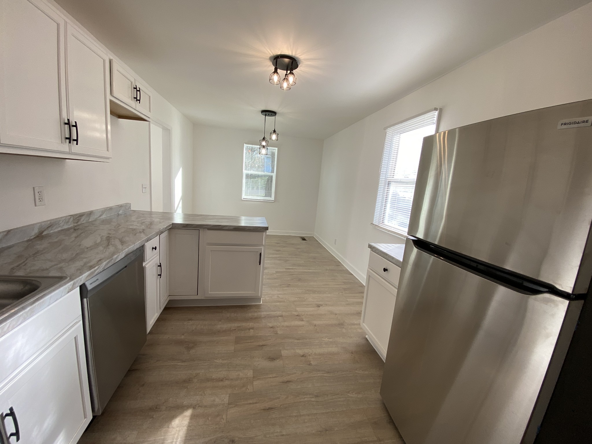 245 Raintree Drive Clarksville, TN 37042 - Photo 8 of 33 a large kitchen with a stove a refrigerator a sink and dishwasher