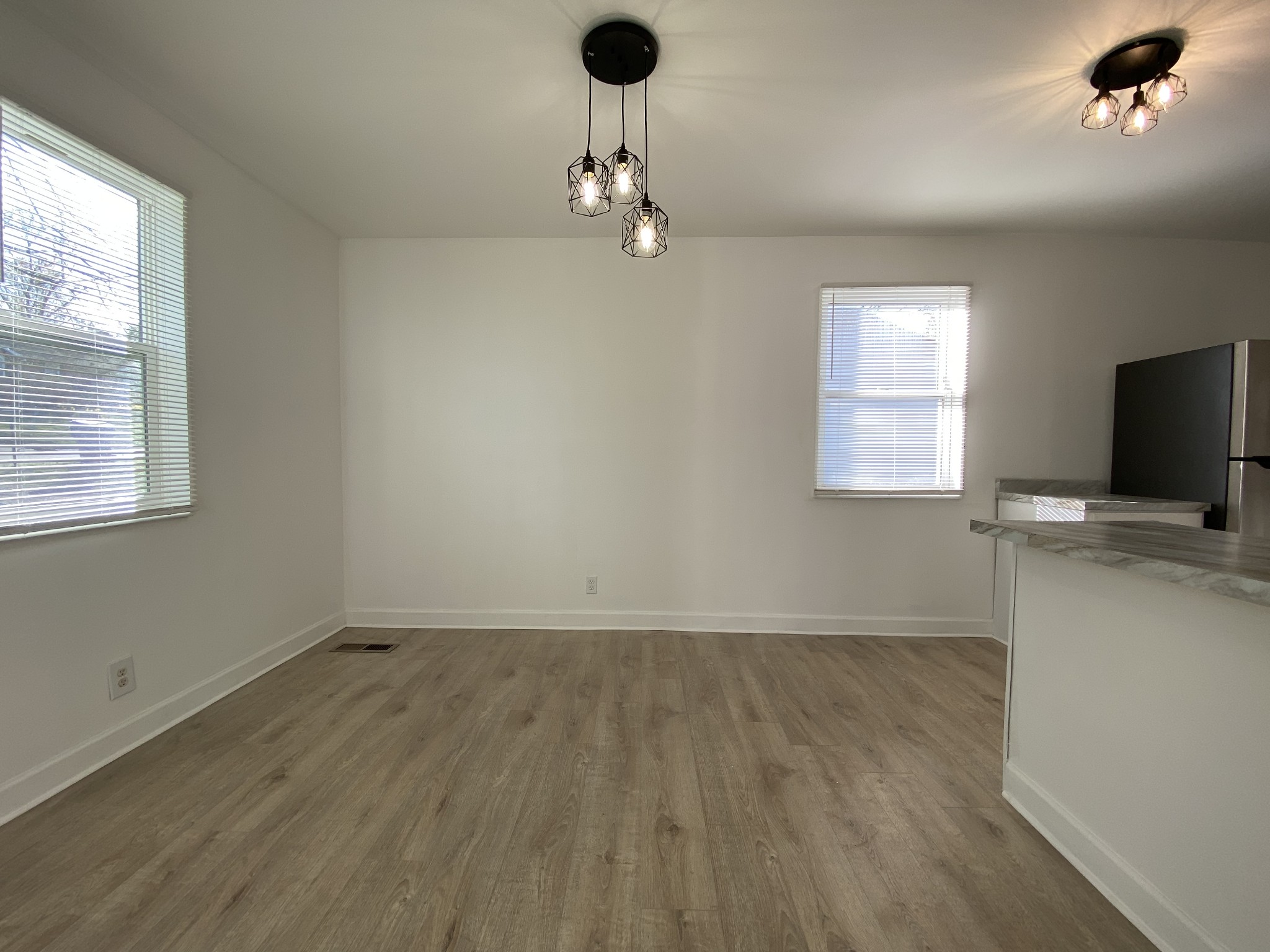 245 Raintree Drive Clarksville, TN 37042 - Photo 9 of 33 wooden floor in an empty room with a window
