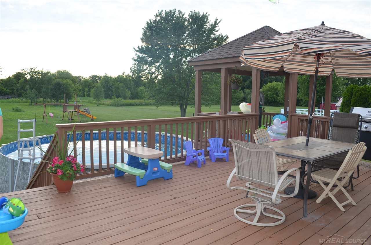 50371 Riverside Drive Macomb, MI 48044 - Photo 26 of 30 Deck in backyard with gazebo