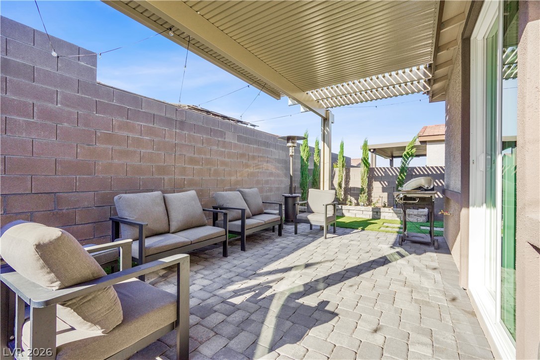 9398 Noble Fir Rdg Court Las Vegas, NV 89143 - Photo 29 of 36 A private paved patio offers an ideal space for outdoor relaxation and entertaining.