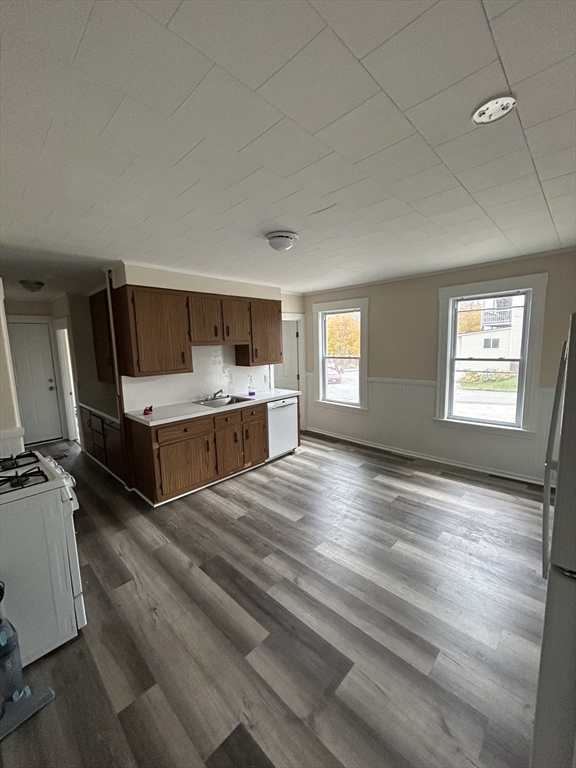 364 Hamilton Street, Unit 1R Southbridge, MA 01550 - Photo 2 of 8 a view of kitchen and empty room with wooden floor