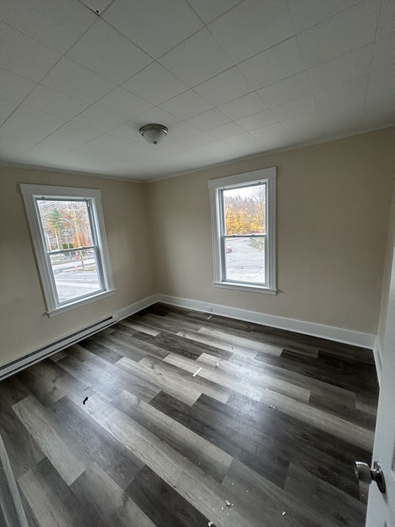 364 Hamilton Street, Unit 1R Southbridge, MA 01550 - Photo 6 of 8 a view of empty room with wooden floor and fan