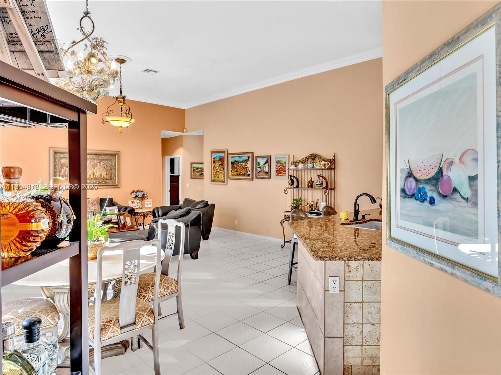900 Spoonbill Circle Weston, FL 33326 - Photo 14 of 51 a view of a dining room with furniture and chandelier