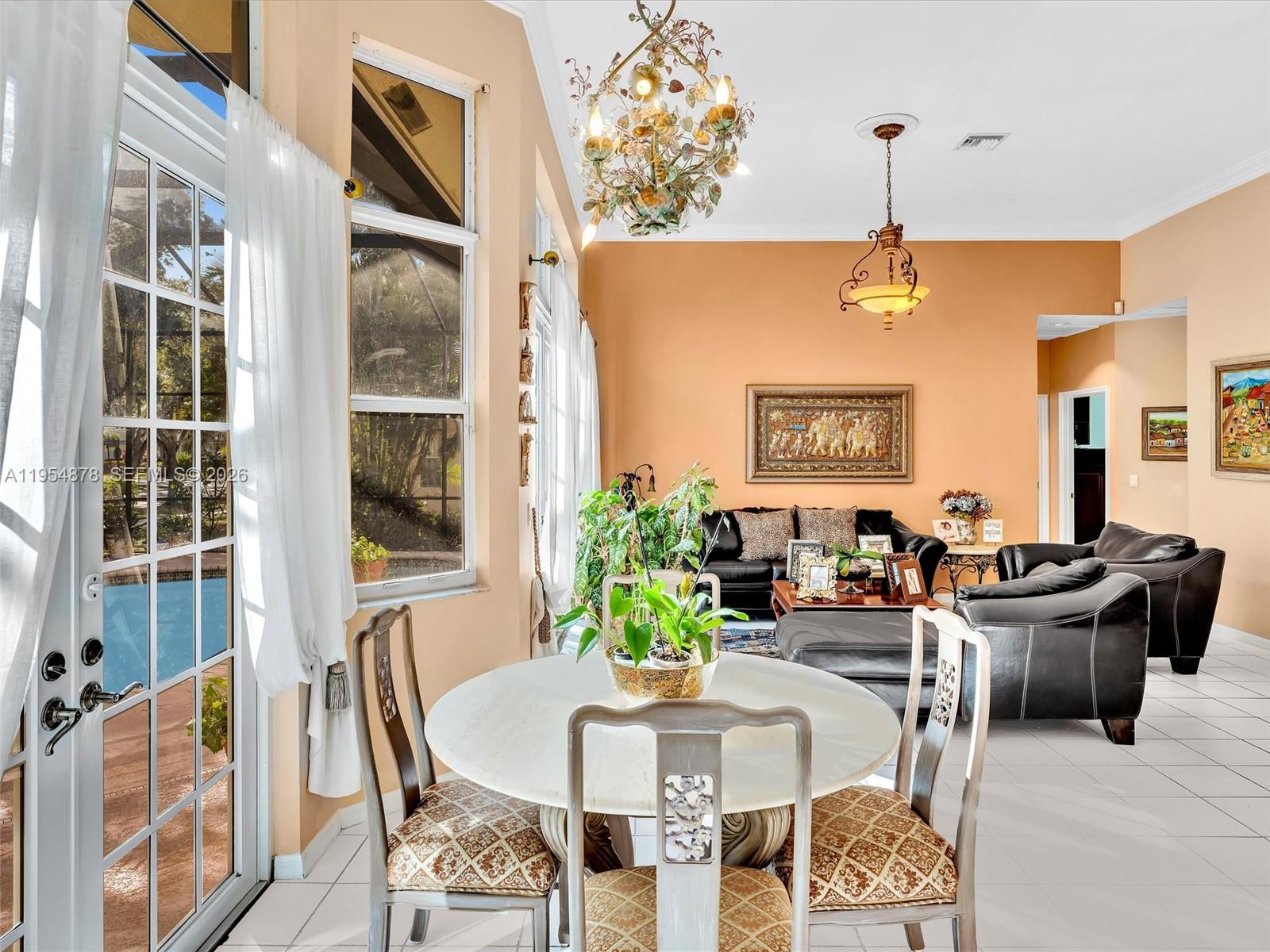 900 Spoonbill Circle Weston, FL 33326 - Photo 15 of 51 a living room with furniture and a potted plant