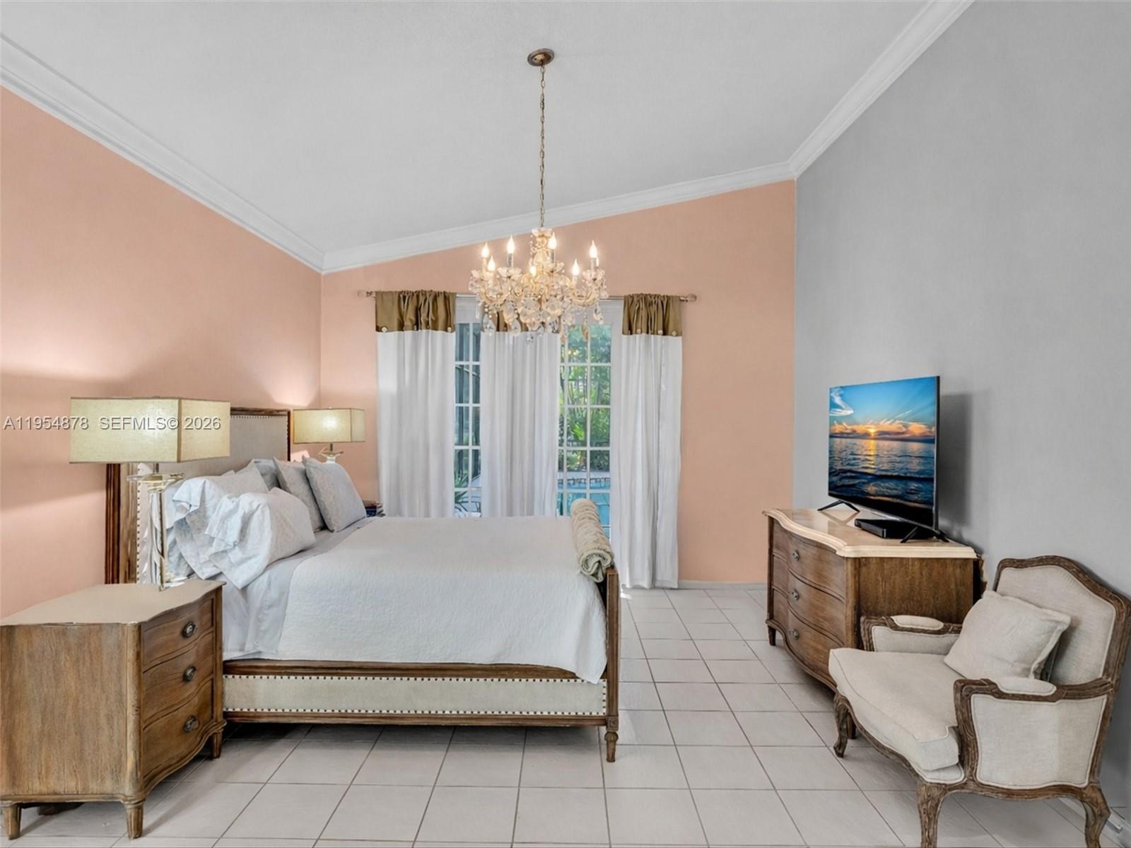 900 Spoonbill Circle Weston, FL 33326 - Photo 23 of 51 a bedroom with a bed and a flat screen tv