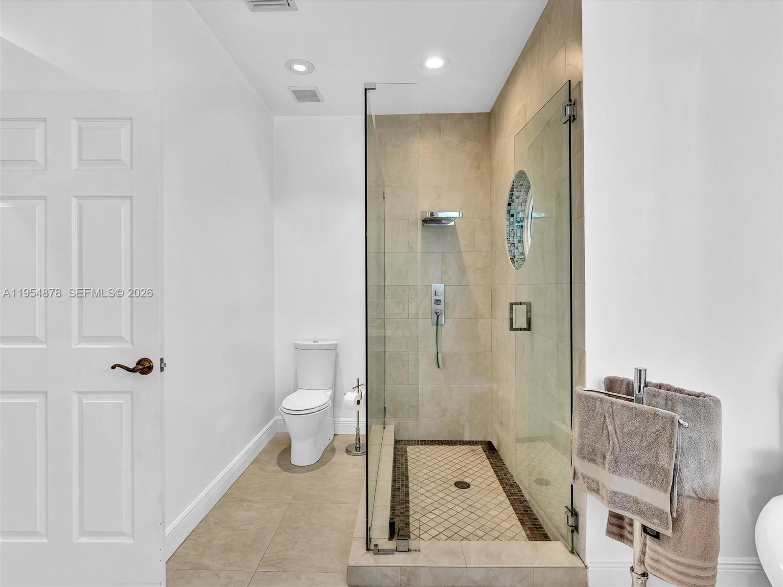 900 Spoonbill Circle Weston, FL 33326 - Photo 28 of 51 a bathroom with a granite countertop shower a toilet and a sink