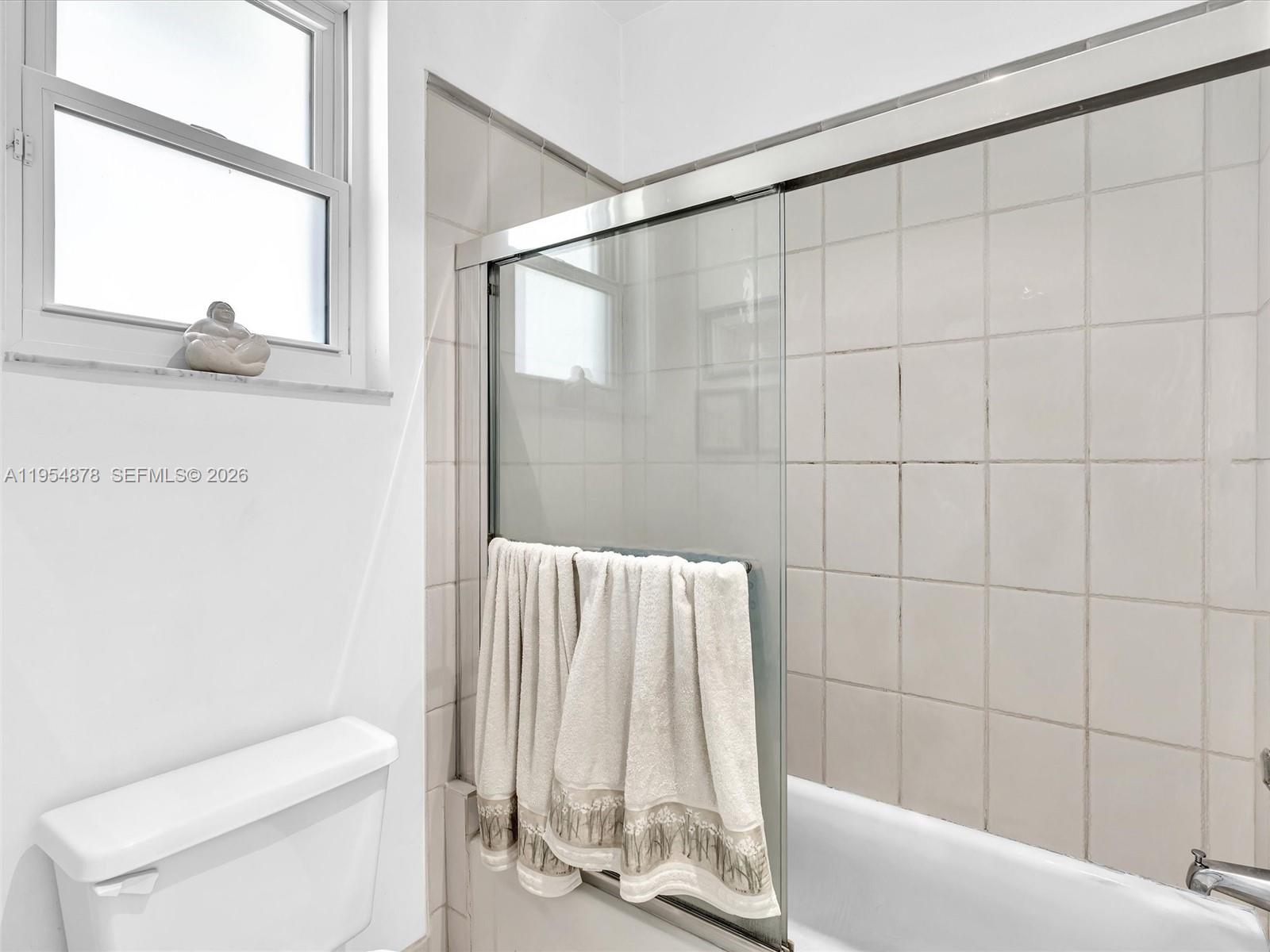 900 Spoonbill Circle Weston, FL 33326 - Photo 33 of 51 a bathroom with a toilet and a shower