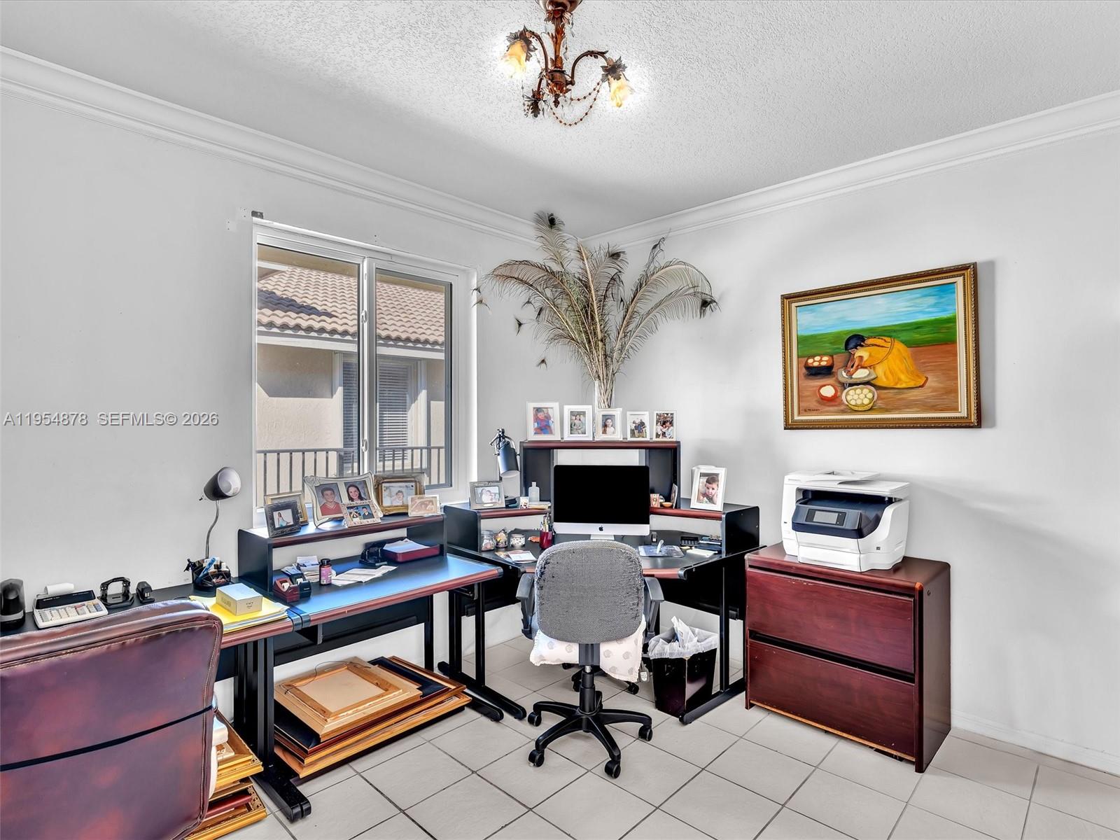 900 Spoonbill Circle Weston, FL 33326 - Photo 39 of 51 a work room with furniture and a flat screen tv