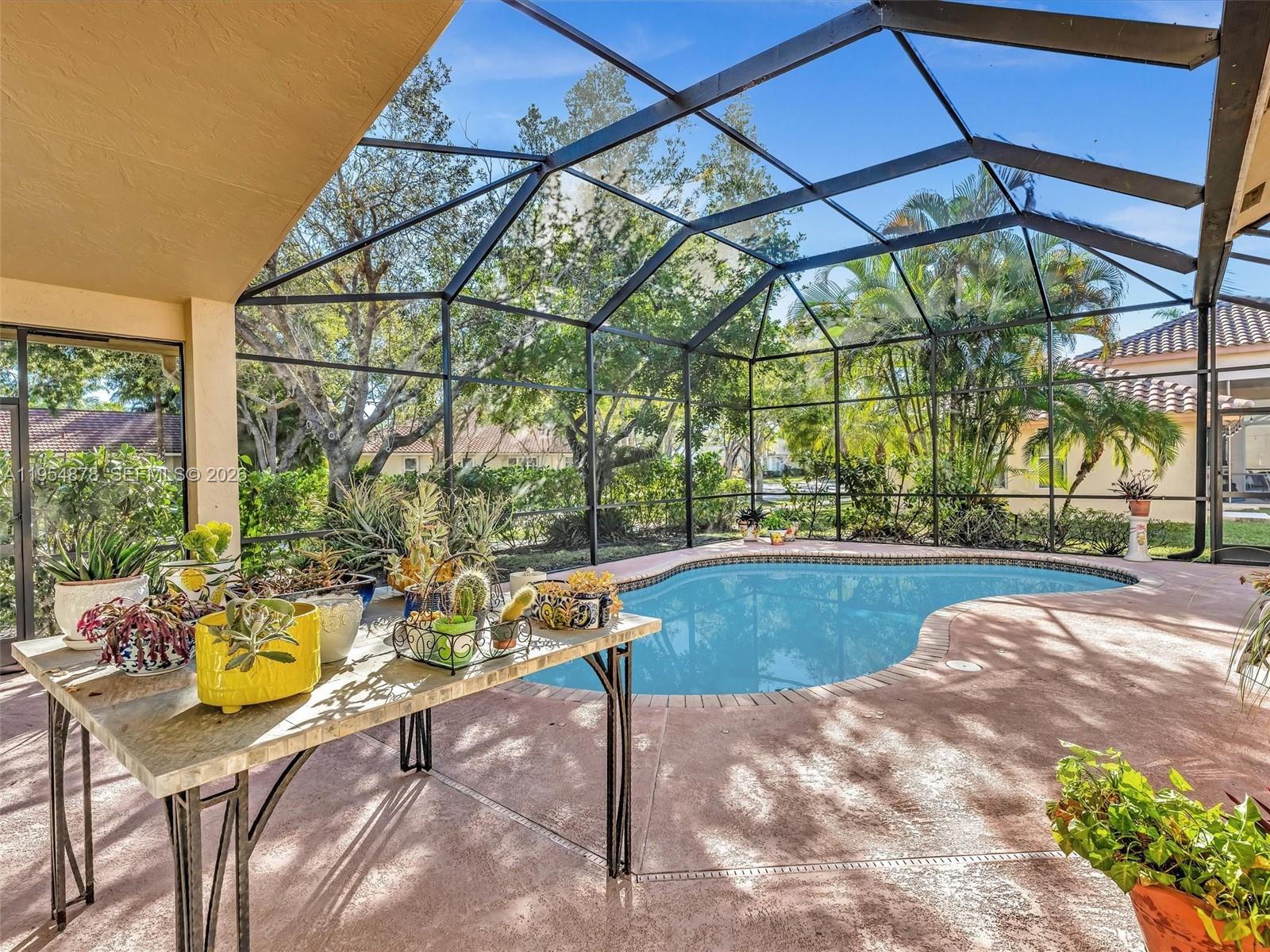 900 Spoonbill Circle Weston, FL 33326 - Photo 41 of 51 a view of swimming pool with a patio