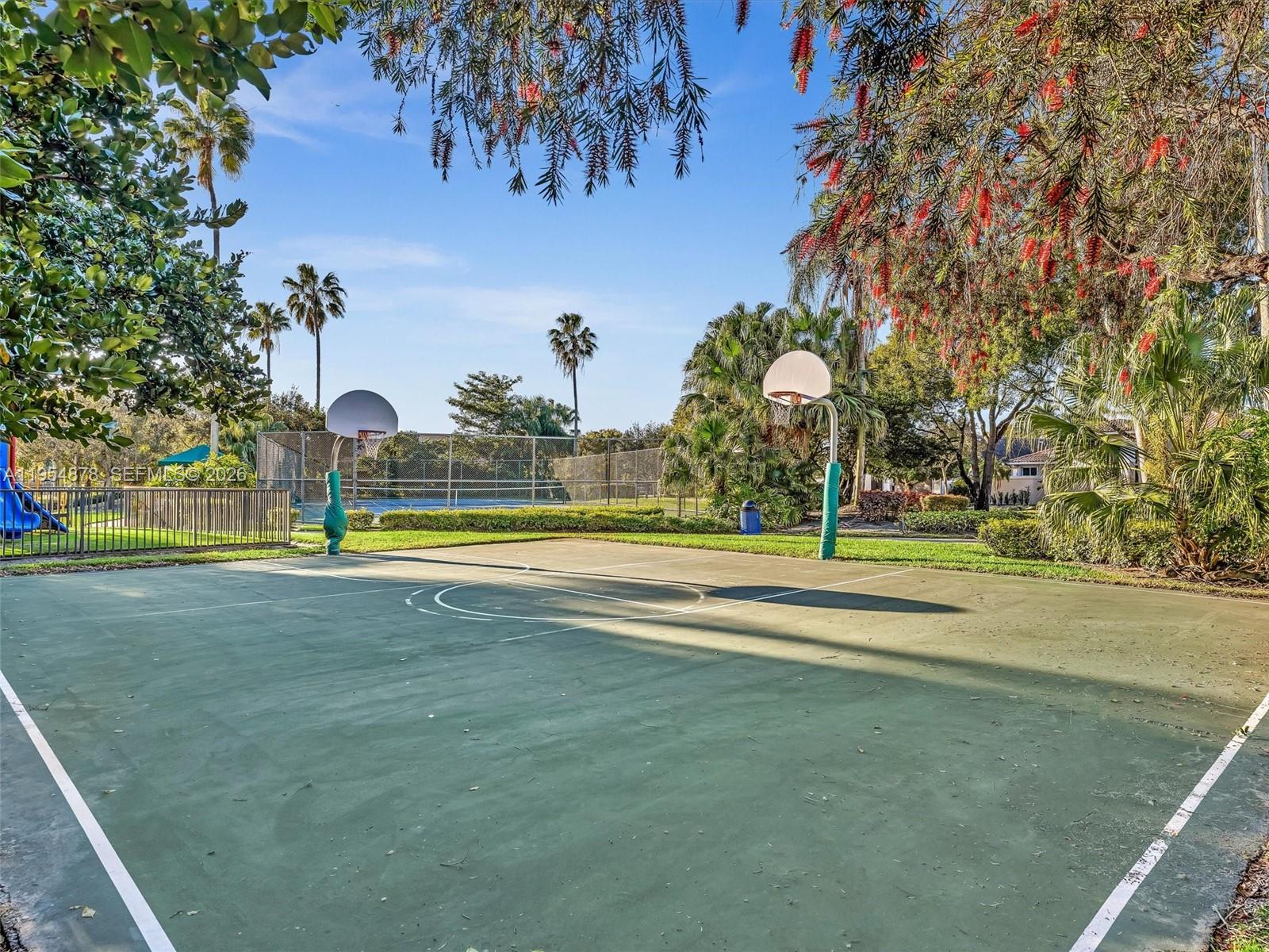 900 Spoonbill Circle Weston, FL 33326 - Photo 49 of 51 a view of a playground with basketball court