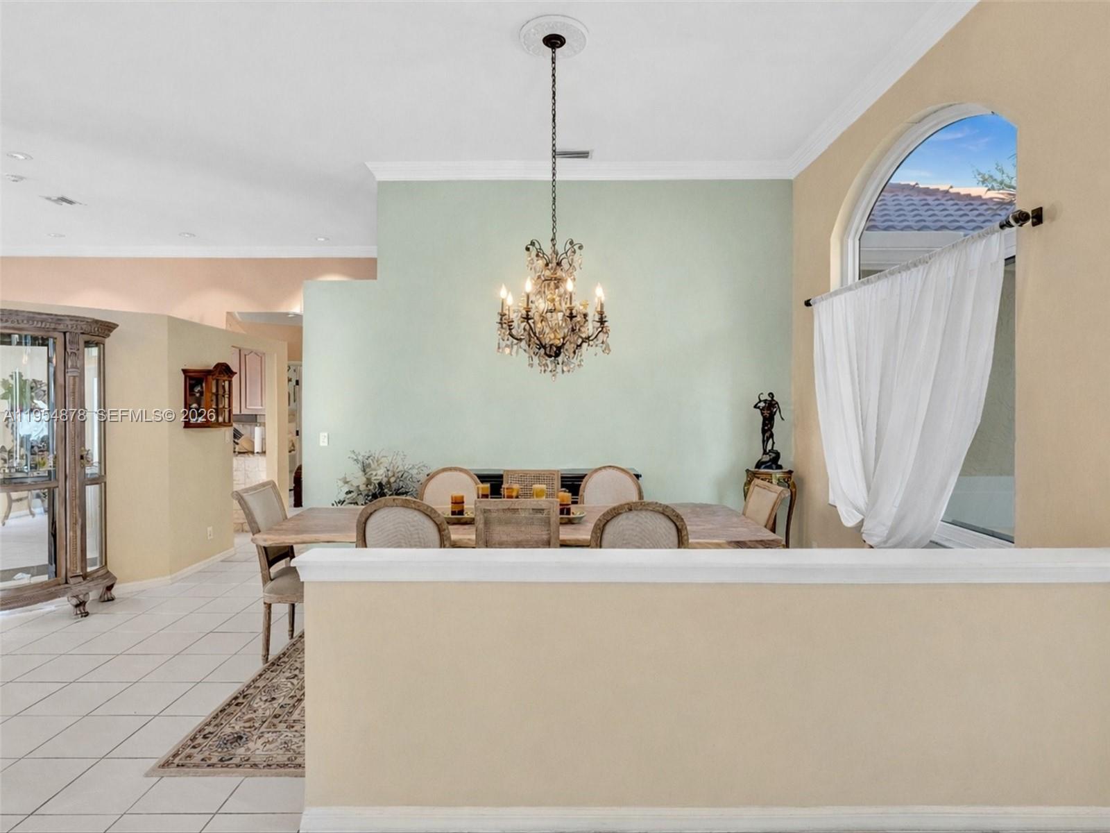 900 Spoonbill Circle Weston, FL 33326 - Photo 5 of 51 a dining room with a table and chairs