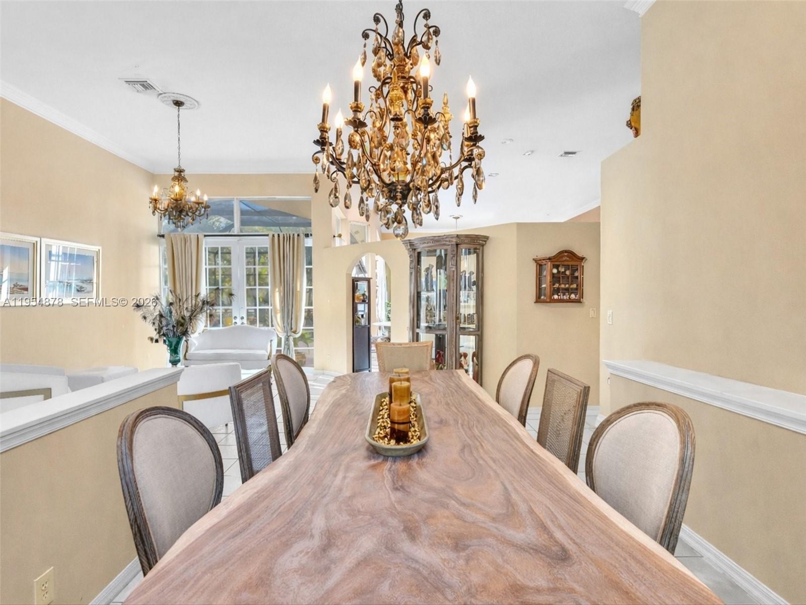 900 Spoonbill Circle Weston, FL 33326 - Photo 6 of 51 a view of a dining room with furniture window and wooden floor