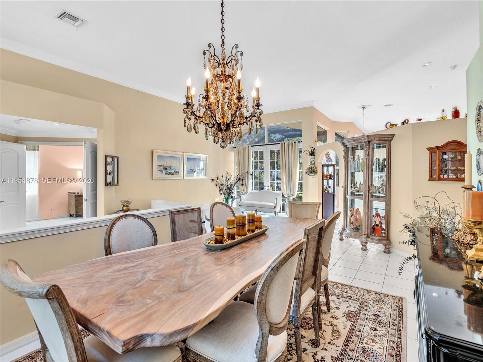 900 Spoonbill Circle Weston, FL 33326 - Photo 7 of 51 a dining room with furniture and window