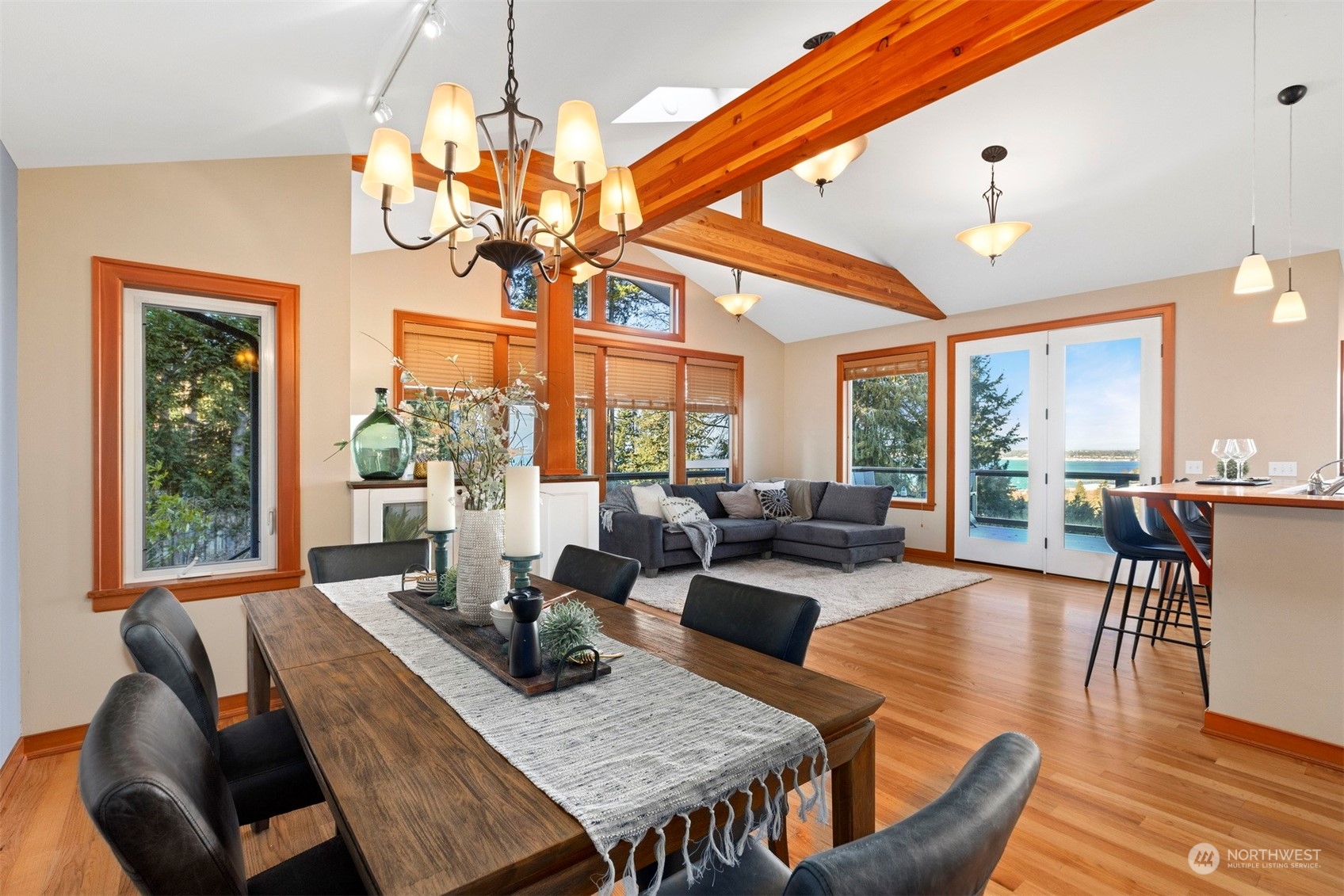 131 Hawthorn Road Bellingham, WA 98225 - Photo 16 of 40 a view of a dining room with furniture a chandelier and wooden floor