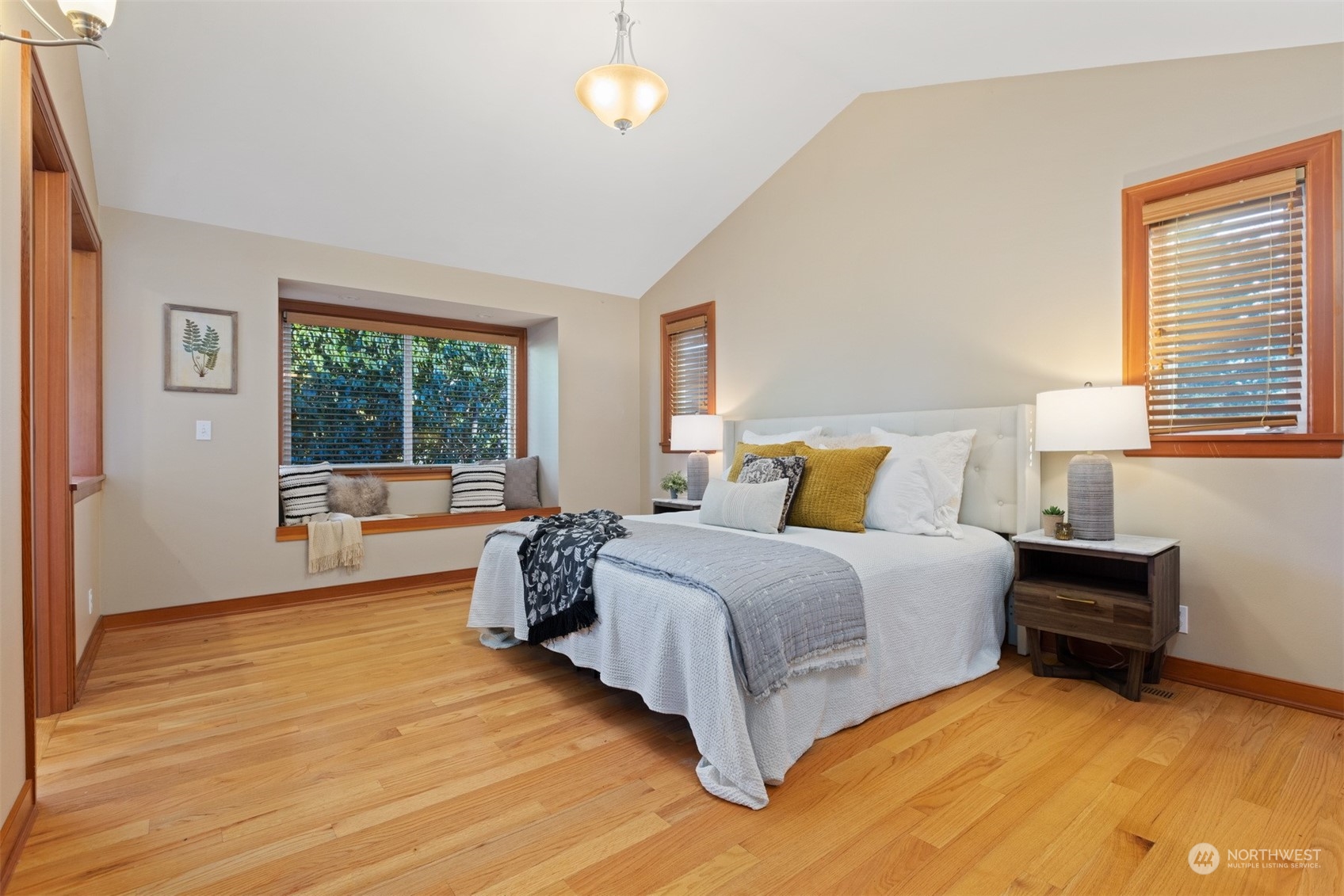 131 Hawthorn Road Bellingham, WA 98225 - Photo 22 of 40 a spacious bedroom with a bed and a large window