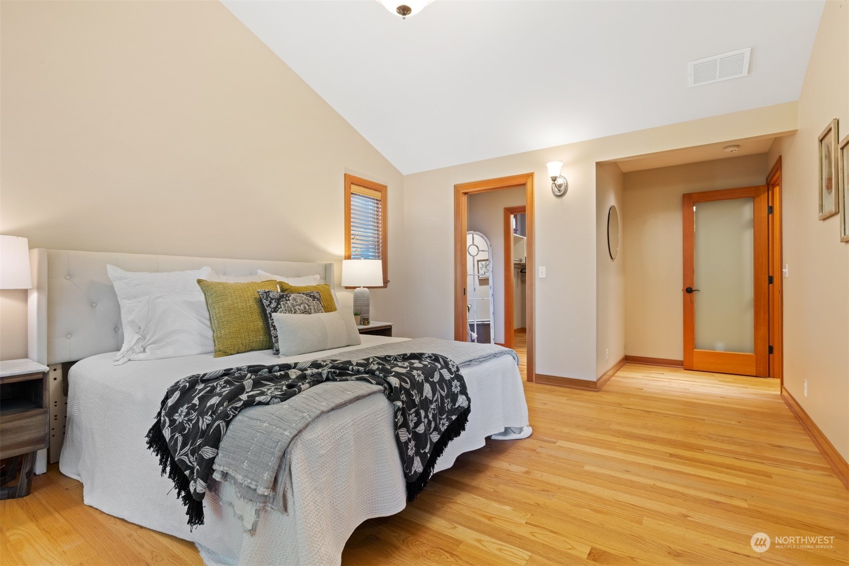 131 Hawthorn Road Bellingham, WA 98225 - Photo 23 of 40 a bedroom with a bed and wooden floor