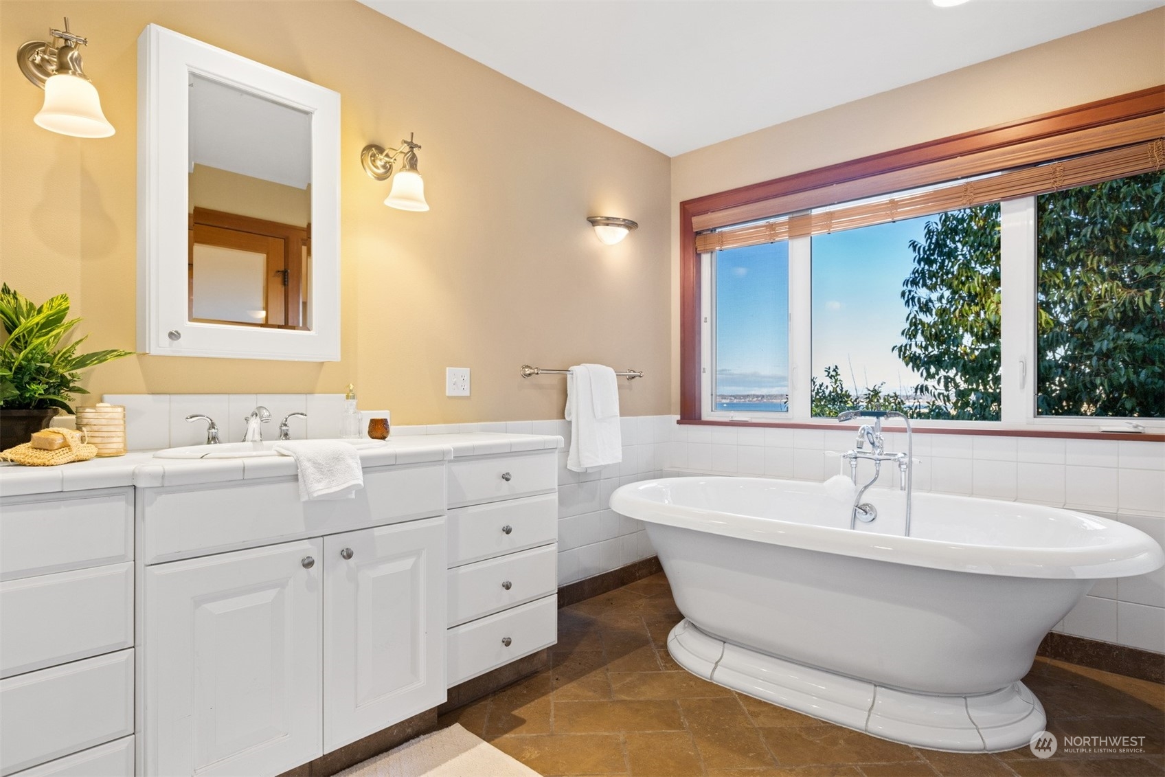 131 Hawthorn Road Bellingham, WA 98225 - Photo 26 of 40 a spacious bathroom with a double vanity sink and a large mirror