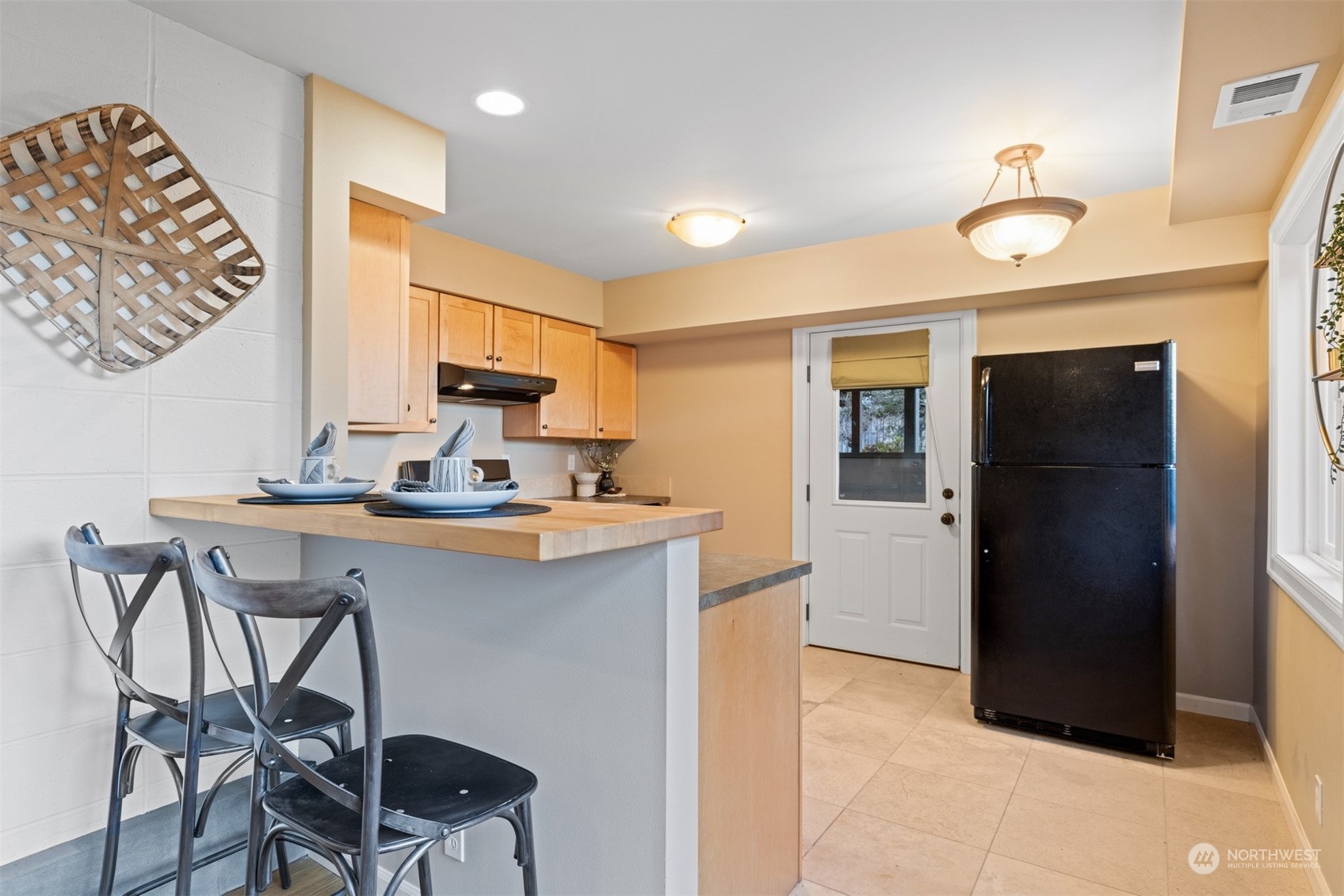 131 Hawthorn Road Bellingham, WA 98225 - Photo 30 of 40 a kitchen with a sink cabinets and refrigerator