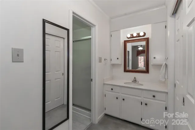a bathroom with a double vanity sink and mirror