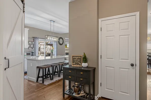 a view of a dining room with furniture and window