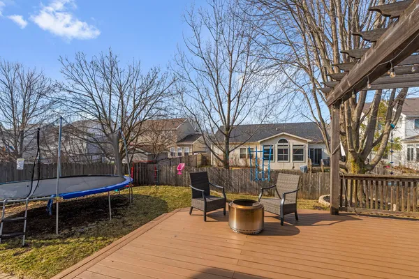 a view of a house with swimming pool and sitting area