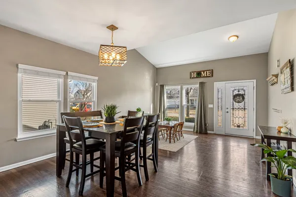 a view of a dining room with furniture window and wooden floor