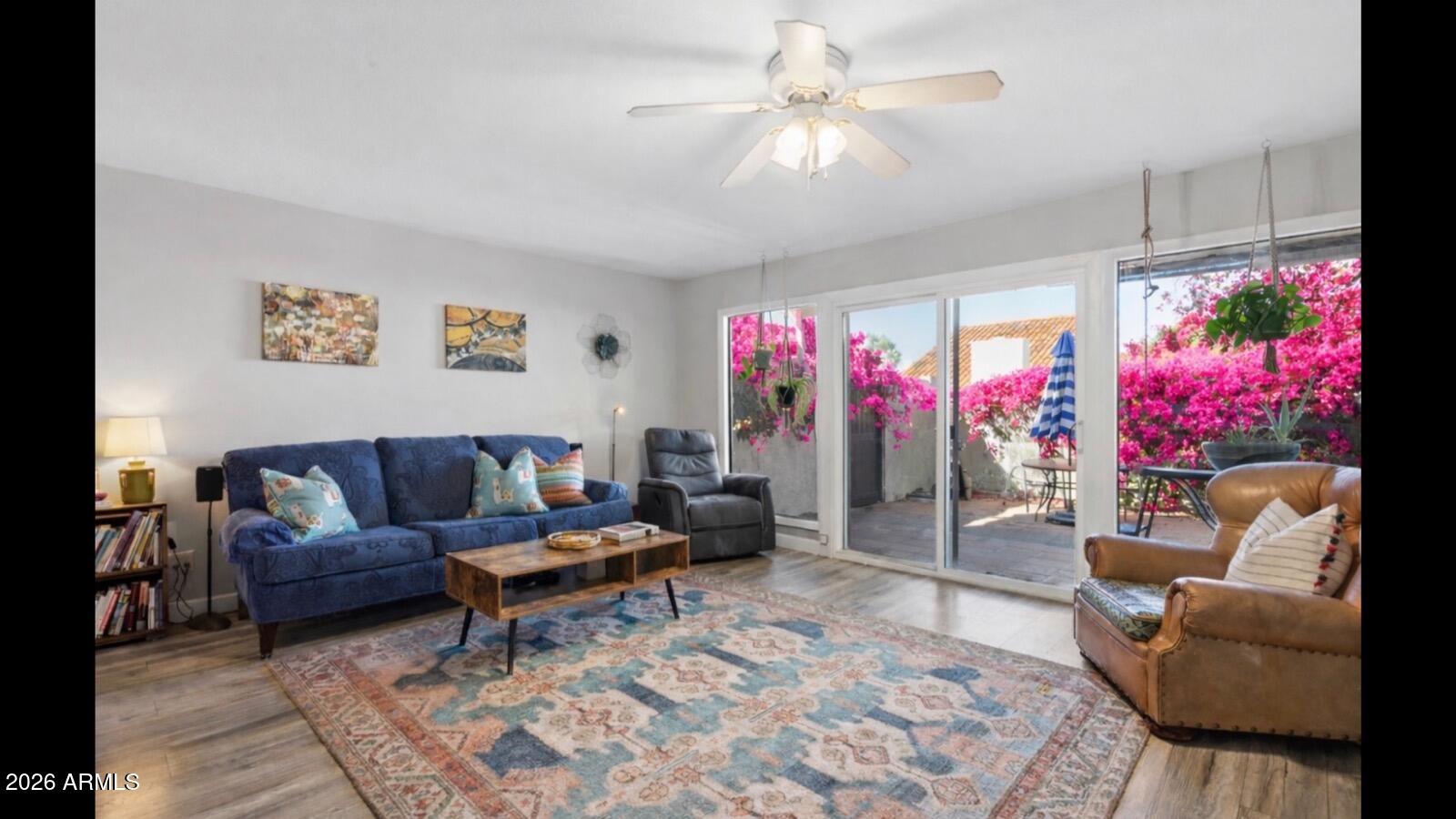 a living room with furniture and a large window