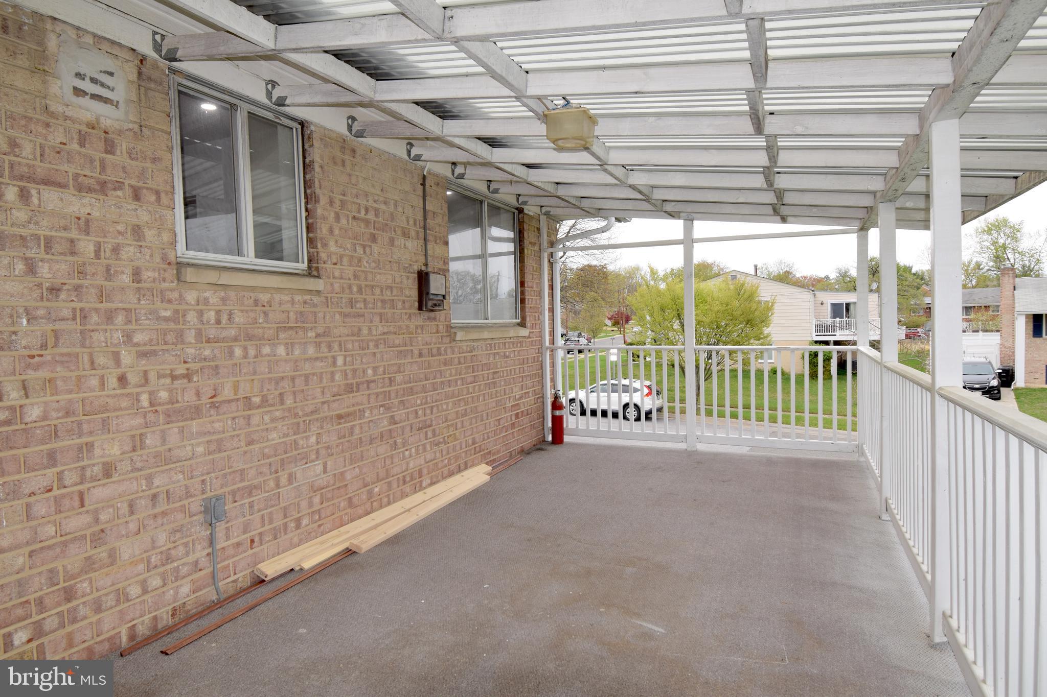 14017 Adkins Road Laurel, MD 20708 - Photo 17 of 18 a view of a porch with a floor to ceiling window