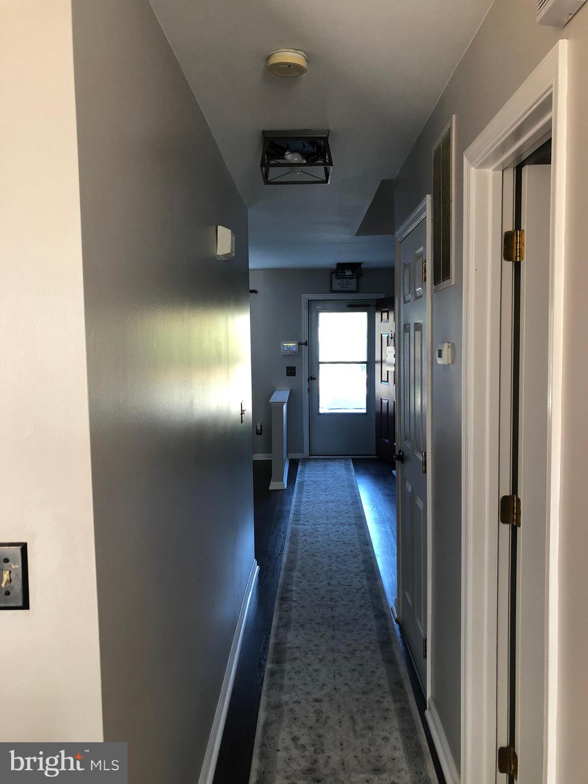 9087 Slate Stone Loop Bristow, VA 20136 - Photo 8 of 28 Hallway from kitchen to front entryway