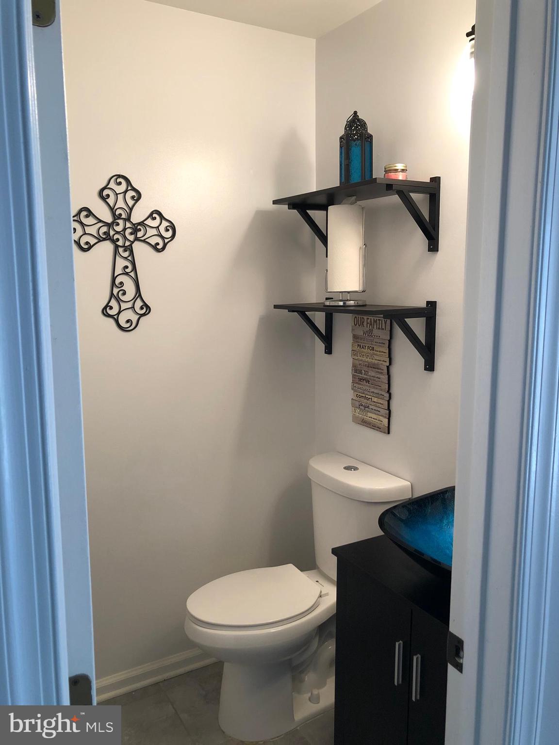 9087 Slate Stone Loop Bristow, VA 20136 - Photo 9 of 28 Powder room off first floor hallway