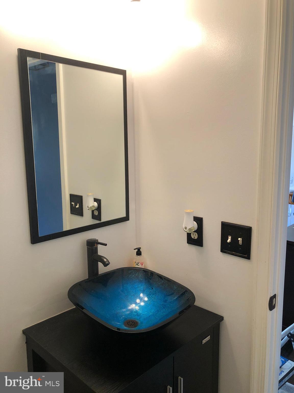 9087 Slate Stone Loop Bristow, VA 20136 - Photo 10 of 28 Powder room off first floor hallway