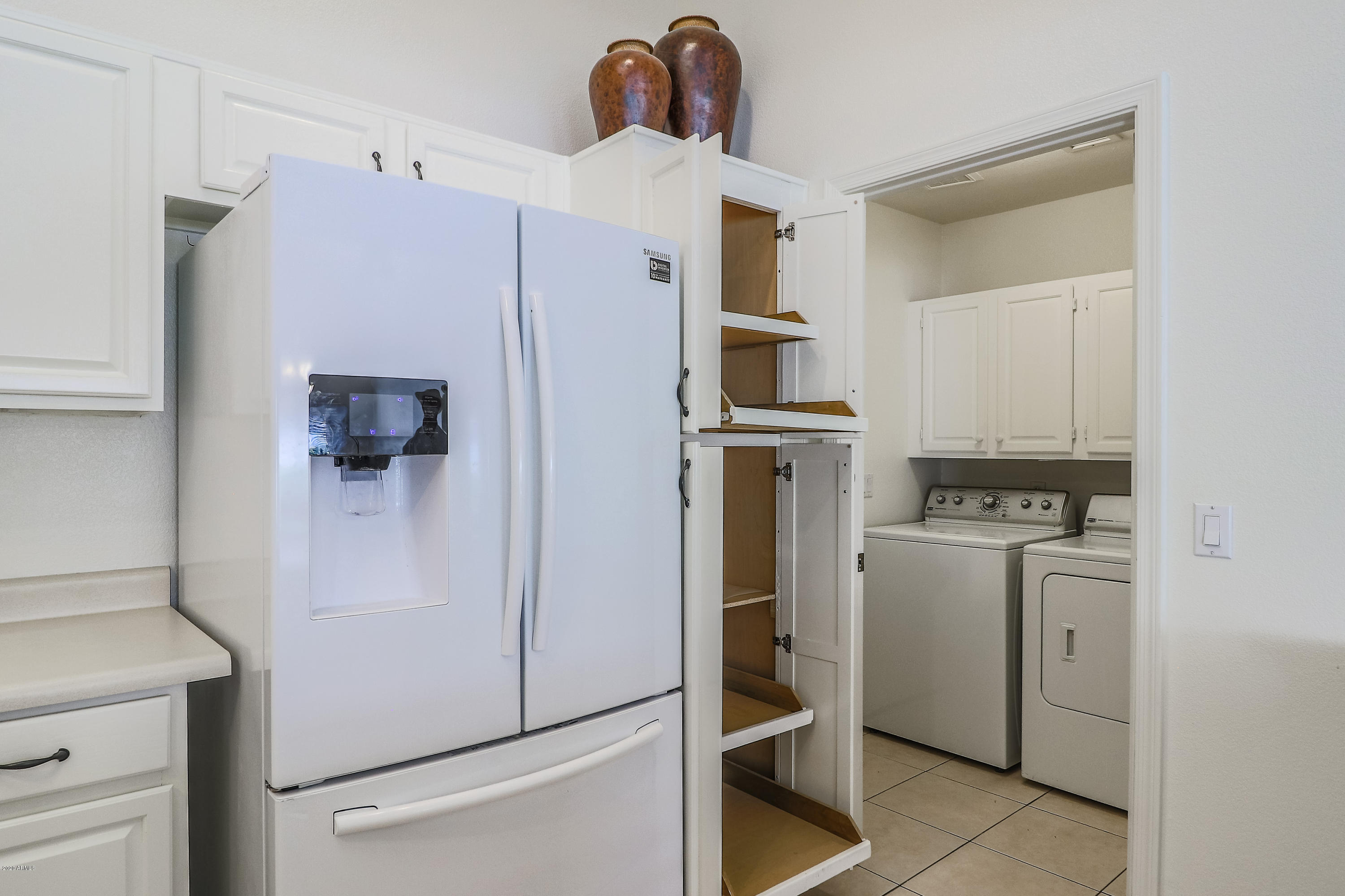 17346 North Inca Way Surprise, AZ 85374 - Photo 18 of 55 Kitchen With Rollout Cabinet Sheves