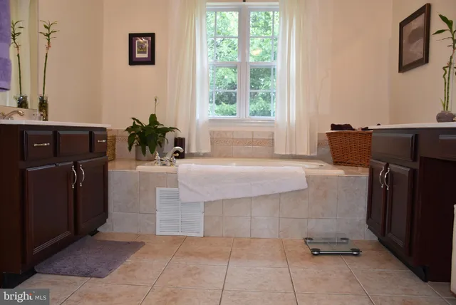a bathroom with a bathtub and a sink