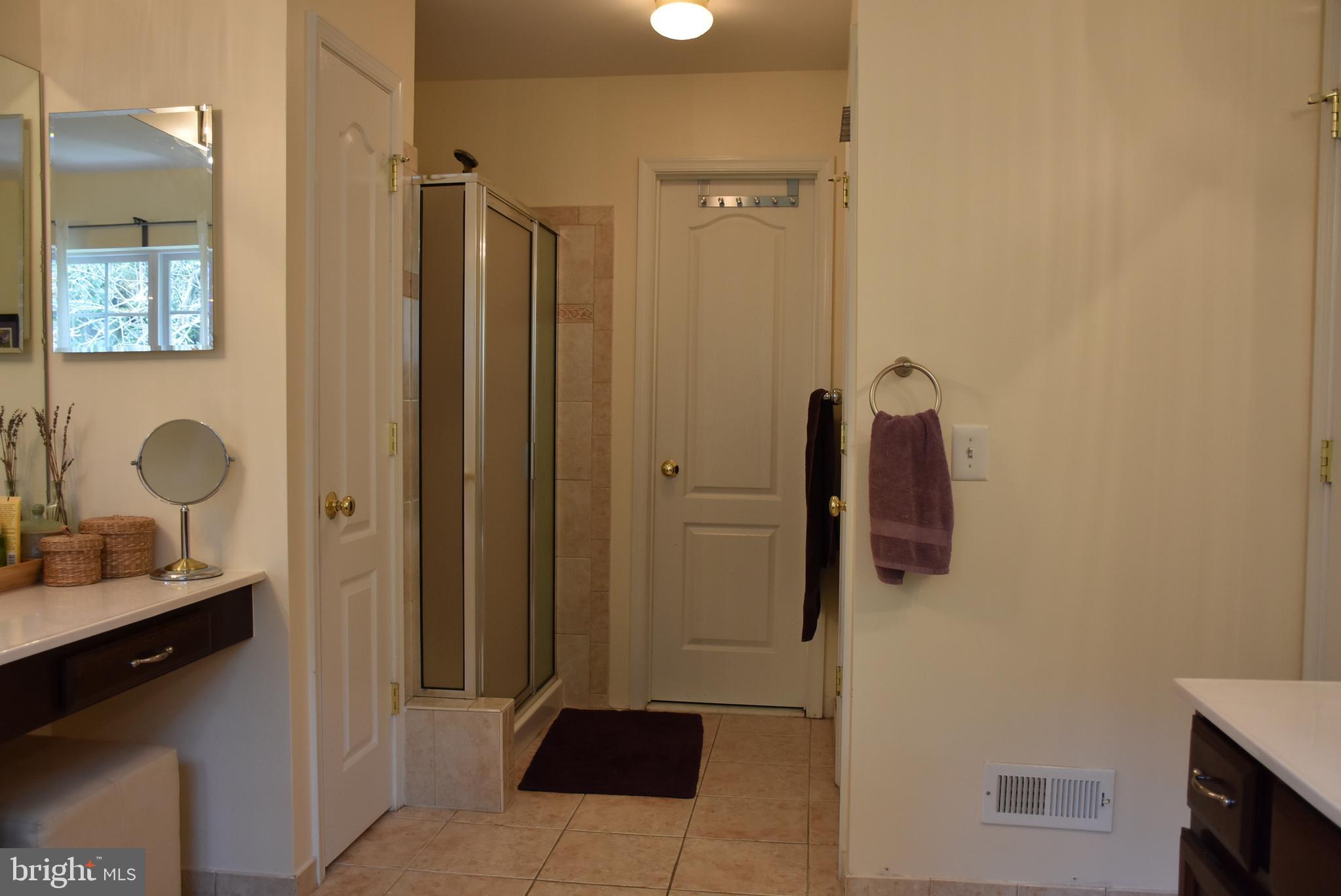 65 Heath Court Pennington, NJ 08534 - Photo 13 of 18 a bathroom with a sink and a mirror