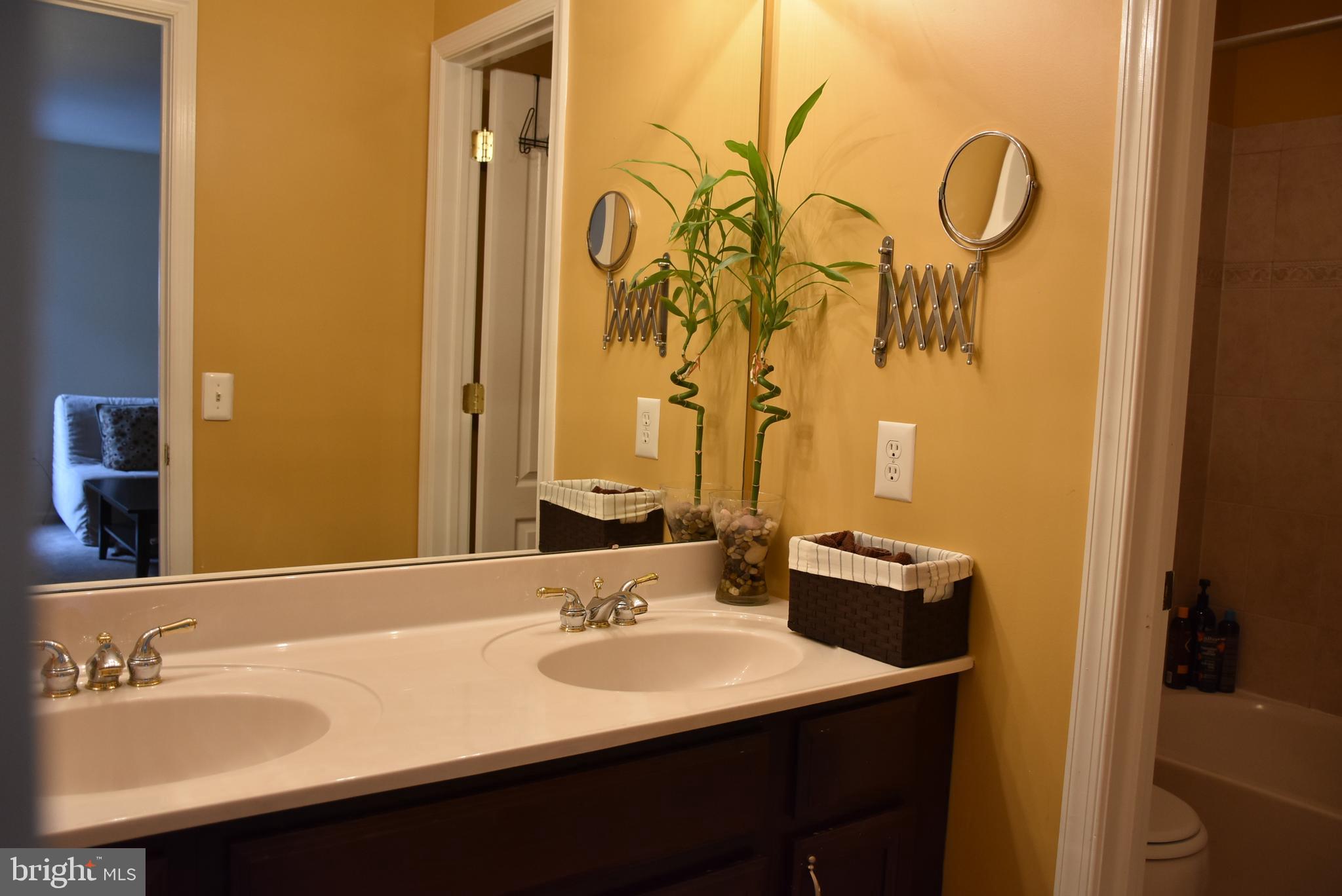 65 Heath Court Pennington, NJ 08534 - Photo 16 of 18 a bathroom with a sink and a mirror