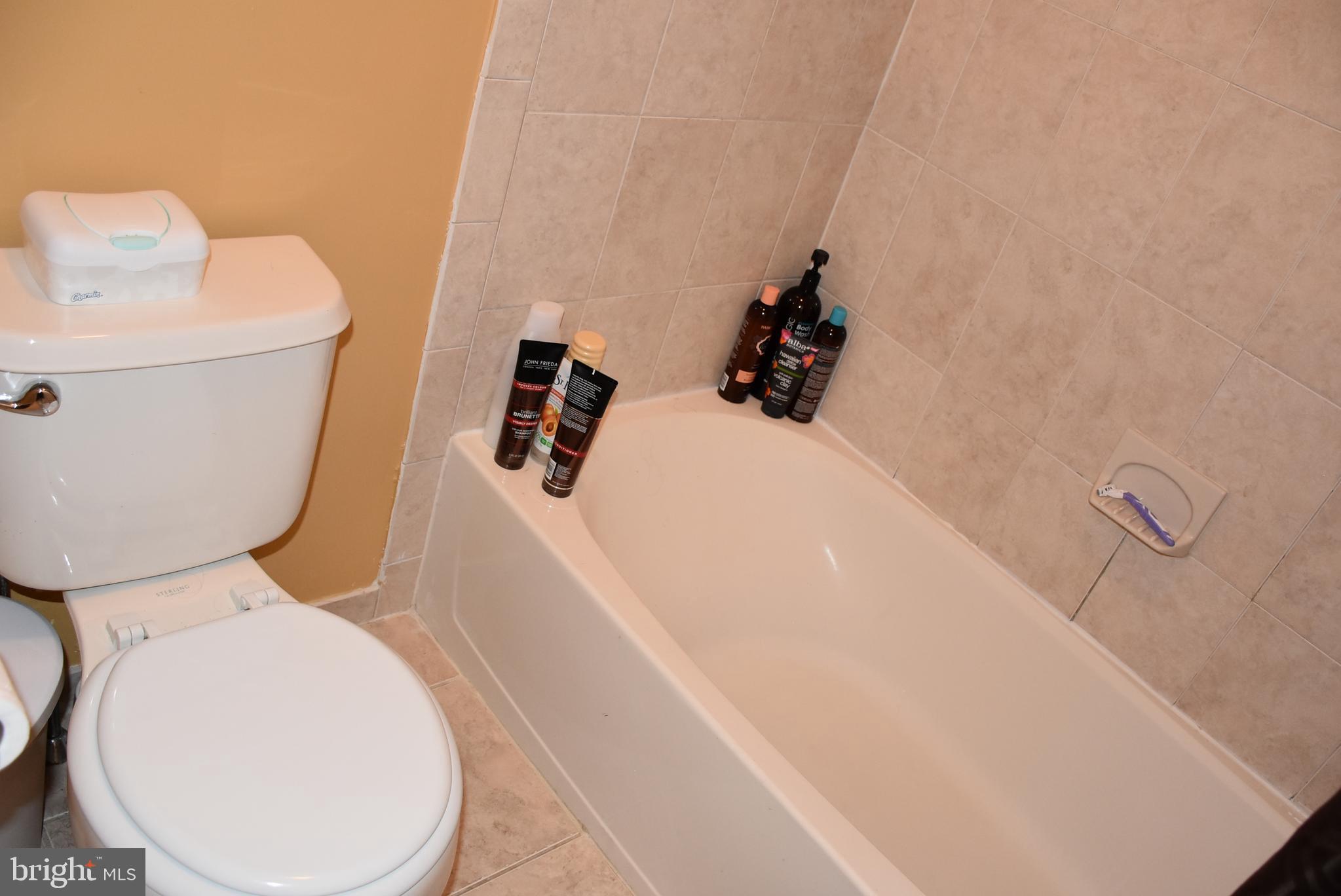 65 Heath Court Pennington, NJ 08534 - Photo 17 of 18 a white toilet sitting next to a white sink