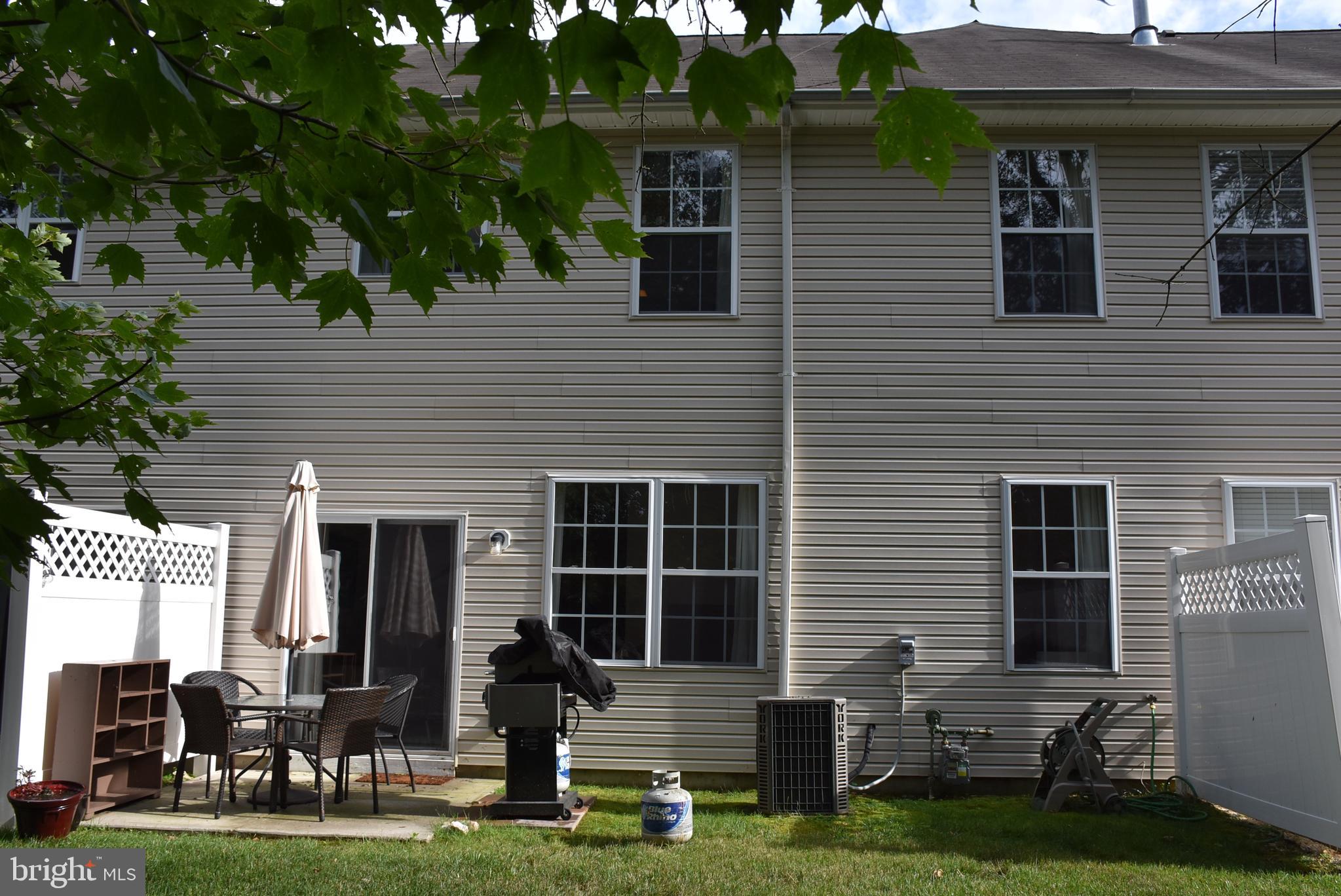 65 Heath Court Pennington, NJ 08534 - Photo 18 of 18 a backyard of a house with seating space
