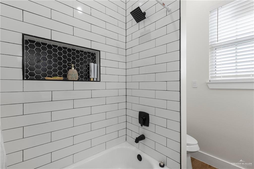 23588 Beefmaster Road Monte Alto, TX 78538 - Photo 20 of 45 a bathroom with a bathtub and shower