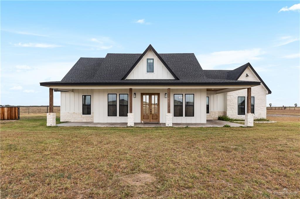 23588 Beefmaster Road Monte Alto, TX 78538 - Photo 2 of 45 a front view of a house with a yard