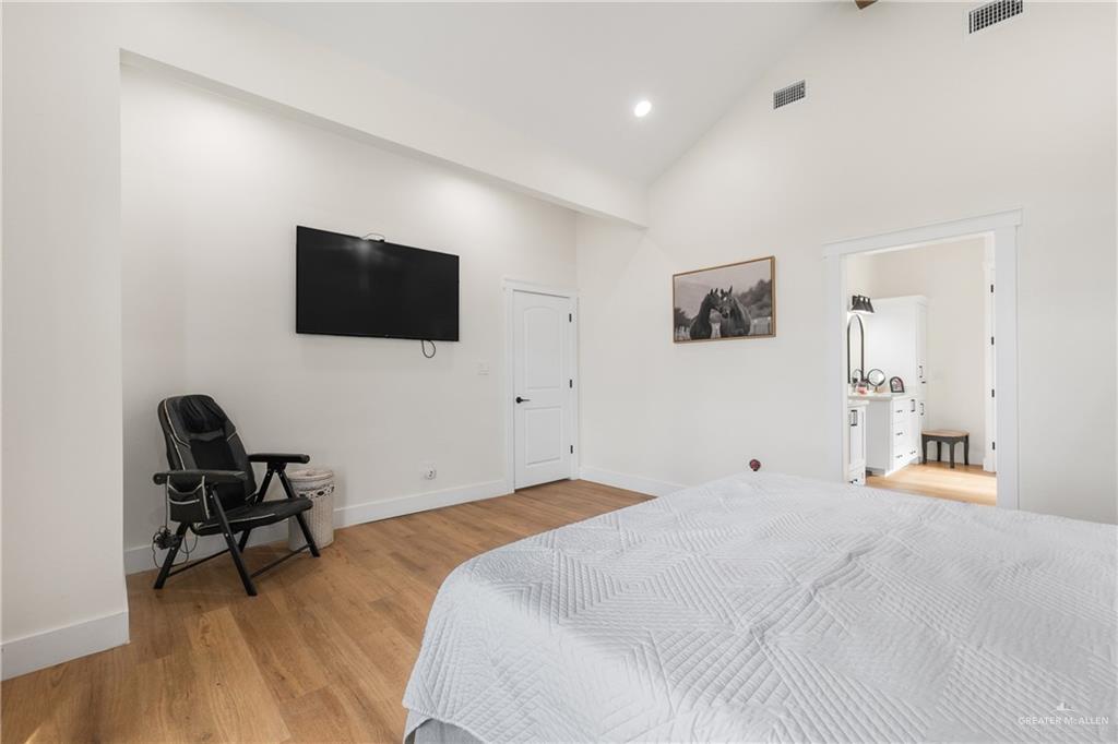 23588 Beefmaster Road Monte Alto, TX 78538 - Photo 24 of 45 a bedroom with a bed and a flat screen tv