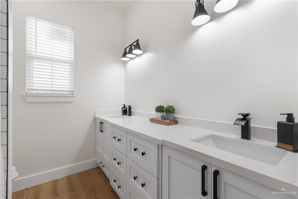 23588 Beefmaster Road Monte Alto, TX 78538 - Photo 28 of 45 a bathroom with a sink and a window