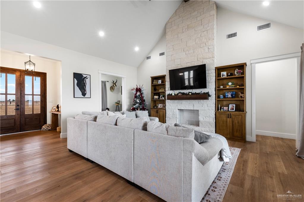 23588 Beefmaster Road Monte Alto, TX 78538 - Photo 5 of 45 a living room with fireplace furniture and a flat screen tv