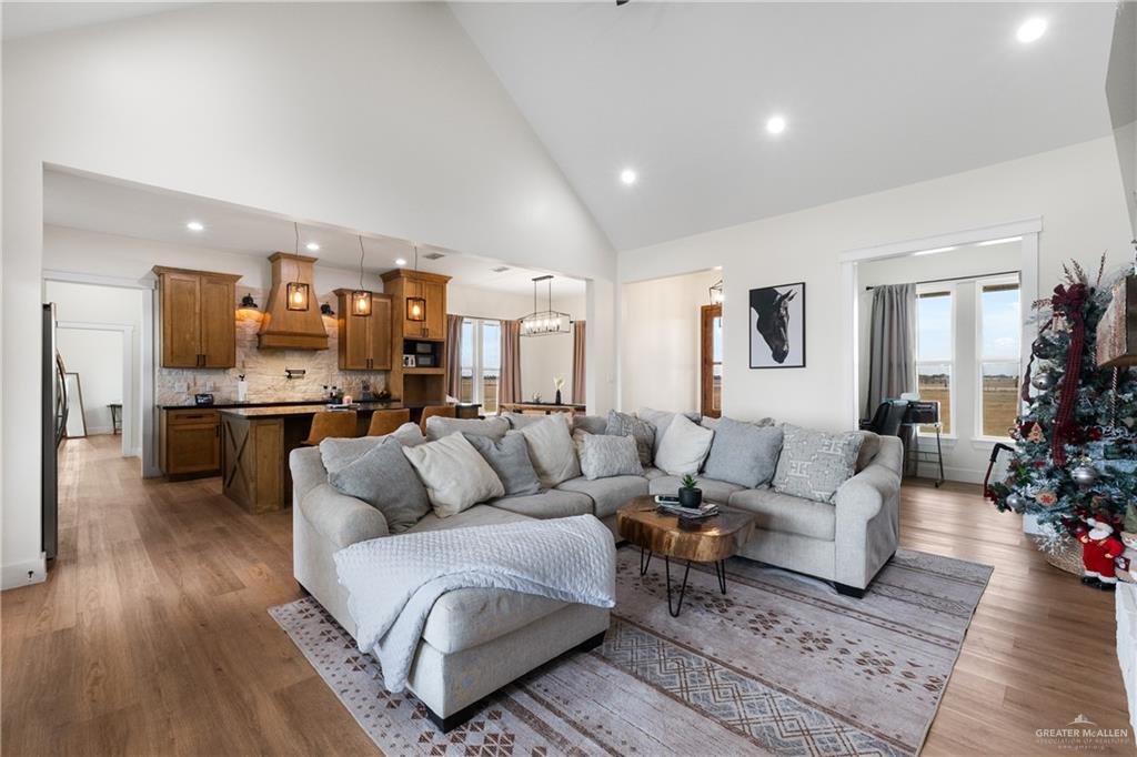 23588 Beefmaster Road Monte Alto, TX 78538 - Photo 6 of 45 a living room with furniture and kitchen view