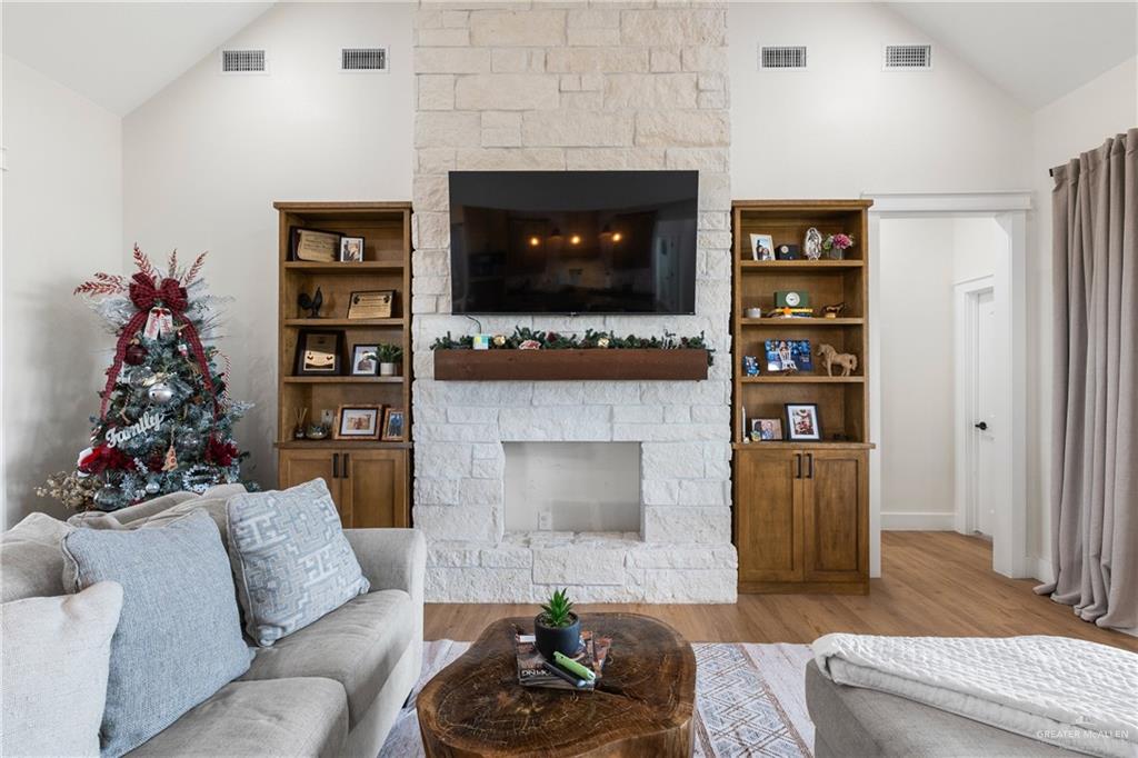 23588 Beefmaster Road Monte Alto, TX 78538 - Photo 7 of 45 a living room with furniture and a fireplace